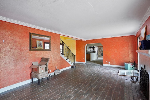 interior space with ornamental molding and dark wood-type flooring