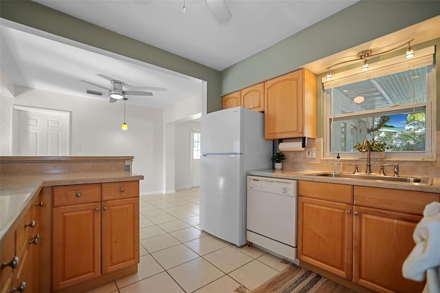 kitchen featuring ceiling fan, sink, light tile patterned floors, and white appliances