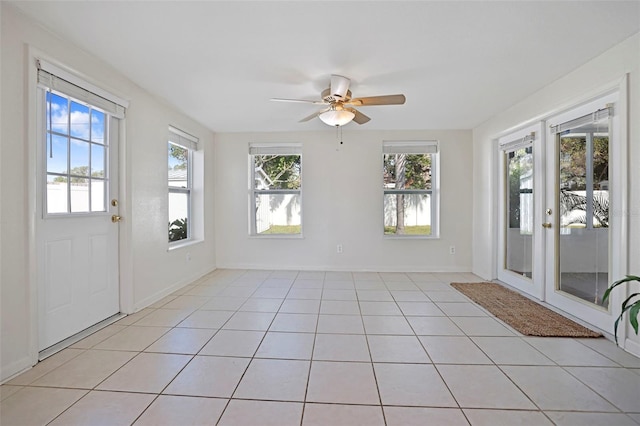 unfurnished sunroom with plenty of natural light and ceiling fan