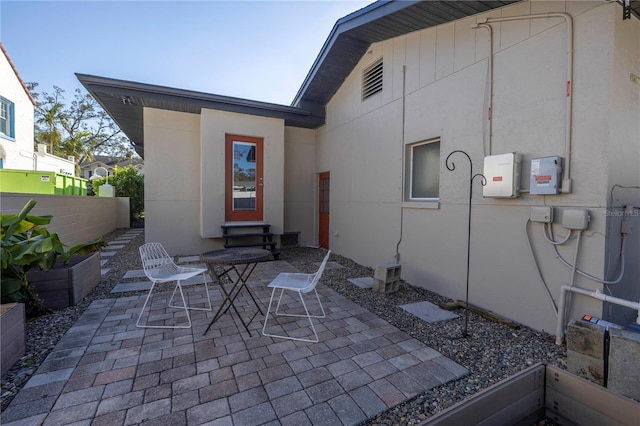 back of house with a patio