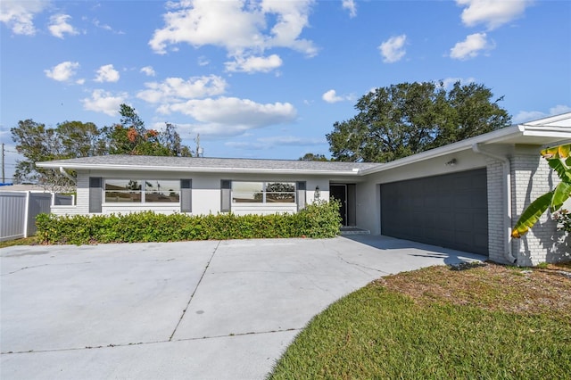 ranch-style house featuring a garage