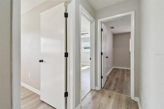 hallway featuring light wood-type flooring