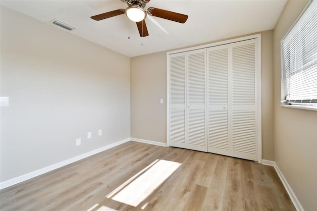 unfurnished bedroom with a closet, ceiling fan, and light hardwood / wood-style flooring