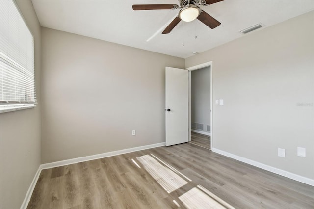 unfurnished room featuring ceiling fan and light hardwood / wood-style floors