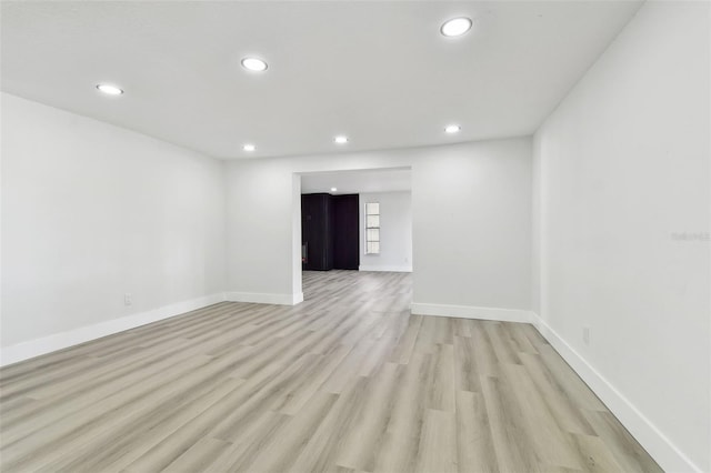 spare room with light hardwood / wood-style flooring