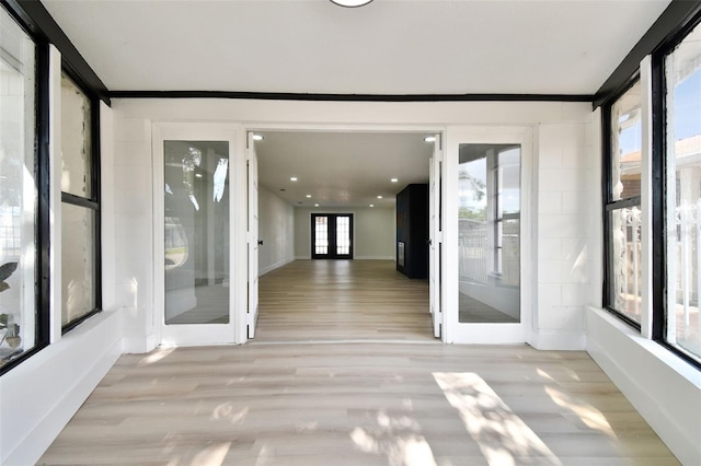 unfurnished sunroom featuring french doors