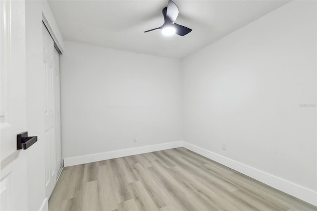 unfurnished room with ceiling fan and light wood-type flooring