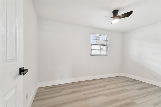 spare room featuring ceiling fan and light hardwood / wood-style flooring