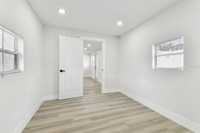 spare room featuring light wood-type flooring