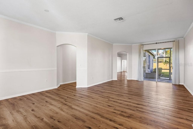 unfurnished room with dark hardwood / wood-style floors and crown molding