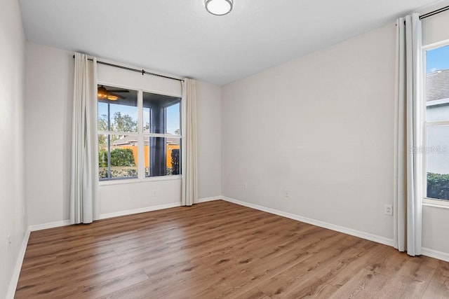 unfurnished room featuring light hardwood / wood-style floors