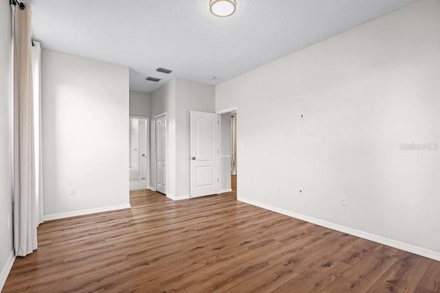 unfurnished bedroom featuring wood-type flooring