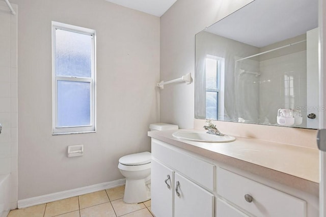 bathroom featuring tile patterned floors, a wealth of natural light, and toilet