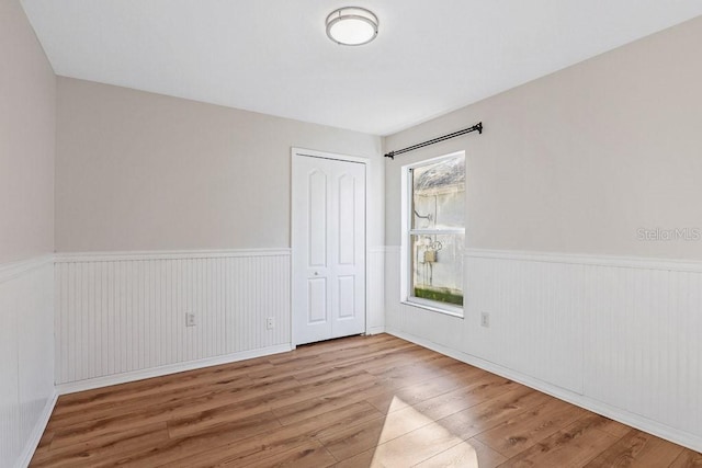 unfurnished room featuring light hardwood / wood-style floors