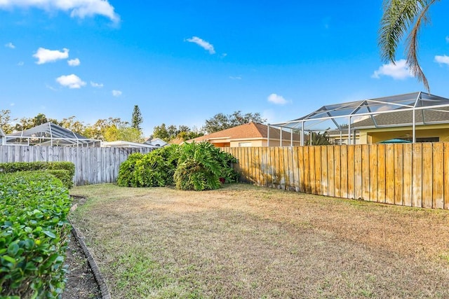 view of yard featuring a lanai