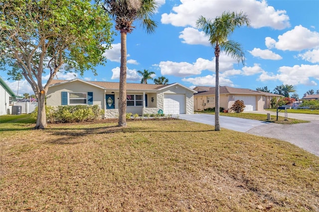 ranch-style home featuring a garage and a front lawn