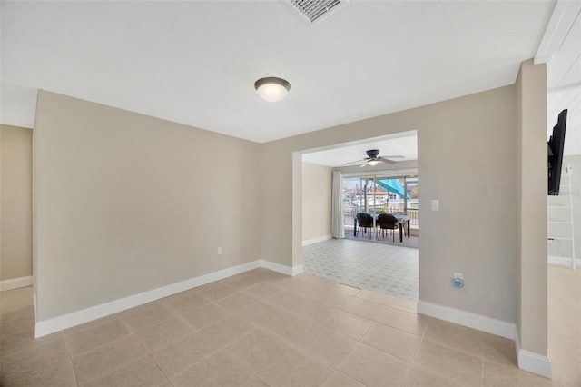 unfurnished room featuring ceiling fan and light tile patterned floors