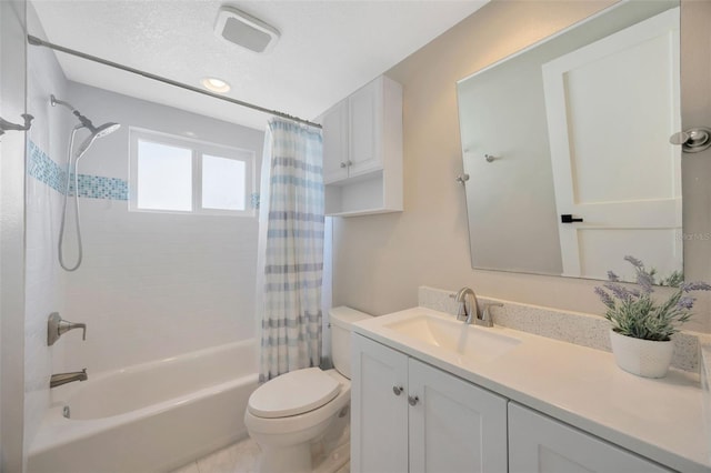 full bathroom featuring tile patterned floors, shower / bath combo, toilet, and vanity