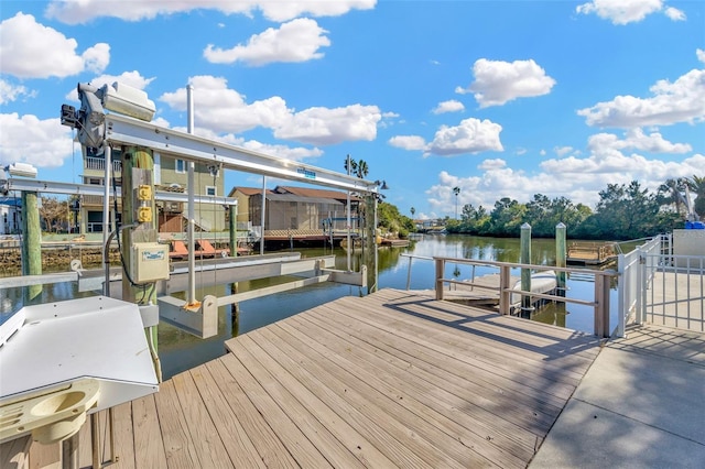 dock area with a water view