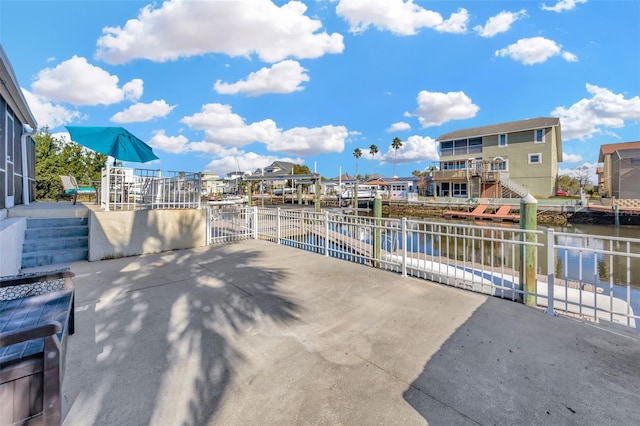 view of patio with a water view