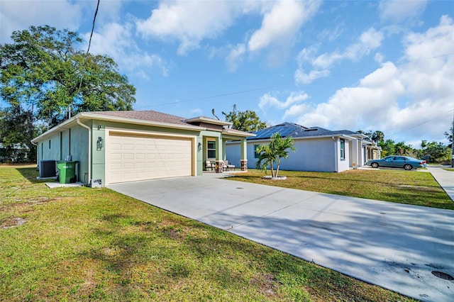 single story home featuring central AC, a garage, and a front lawn