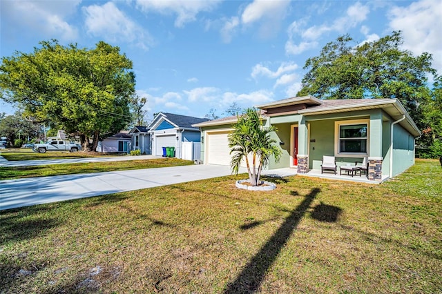 view of front of home with a front yard, a porch, and a garage