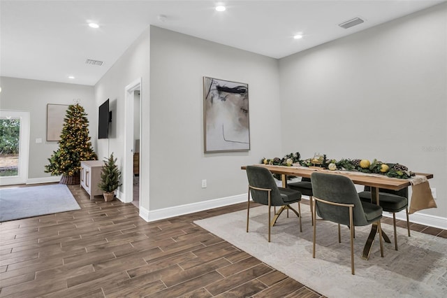 dining room with dark hardwood / wood-style flooring