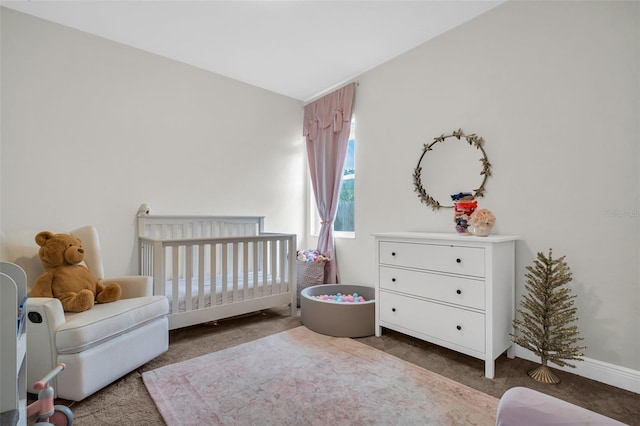 carpeted bedroom with a crib