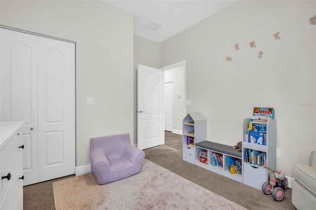 recreation room featuring dark carpet