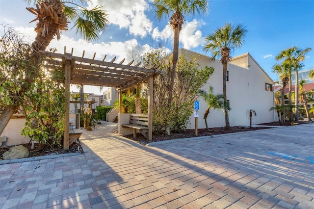 4621 Gulf Of Mexico Dr Unit D10, Longboat Key, FL 34228 - wooden deck with a pergola