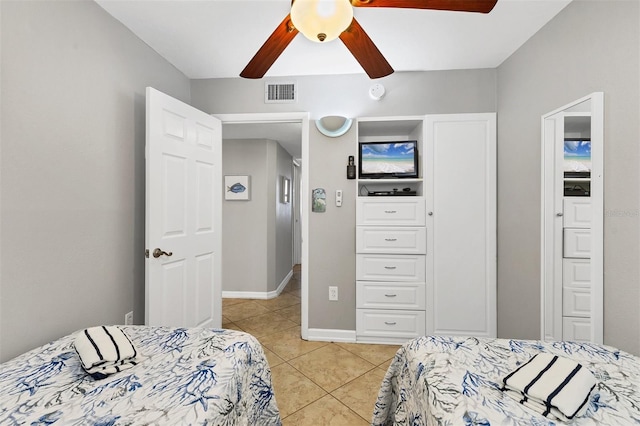 bedroom with light tile patterned floors and ceiling fan