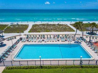 view of pool with a patio and a water view