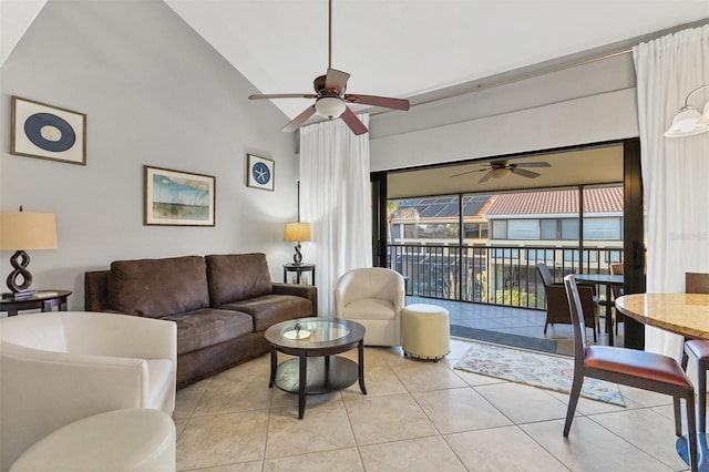 living room with light tile patterned floors, high vaulted ceiling, and ceiling fan