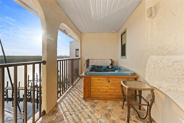 balcony featuring a hot tub