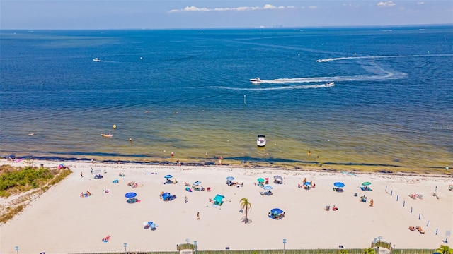 bird's eye view featuring a view of the beach and a water view