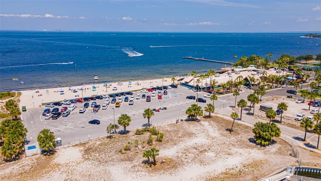 birds eye view of property featuring a view of the beach and a water view