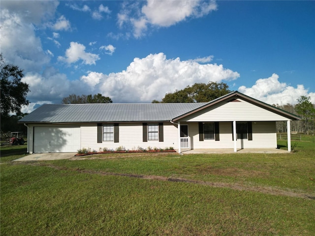 ranch-style house featuring a porch, a garage, and a front lawn