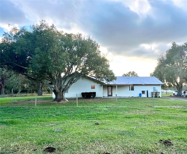 exterior space featuring a lawn