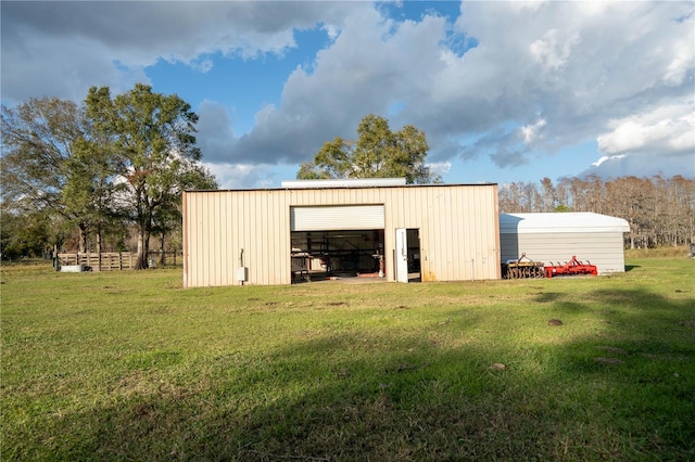 view of outbuilding with a lawn