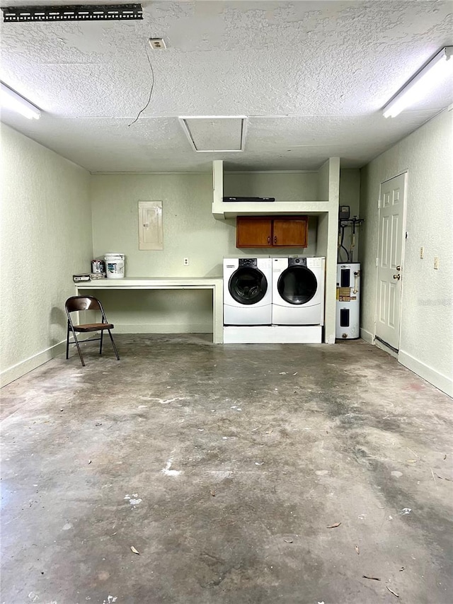 clothes washing area featuring electric panel, water heater, washer and clothes dryer, and a textured ceiling