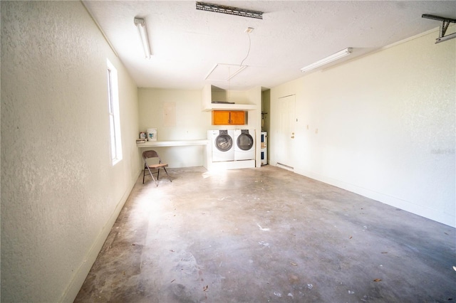 garage with washer and clothes dryer