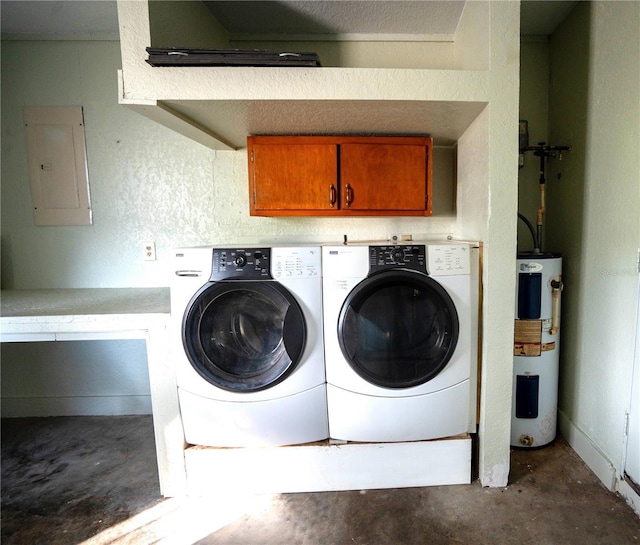 clothes washing area with electric panel, electric water heater, washer and dryer, and cabinets