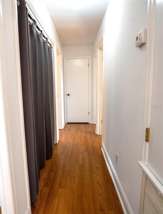 hallway featuring hardwood / wood-style floors