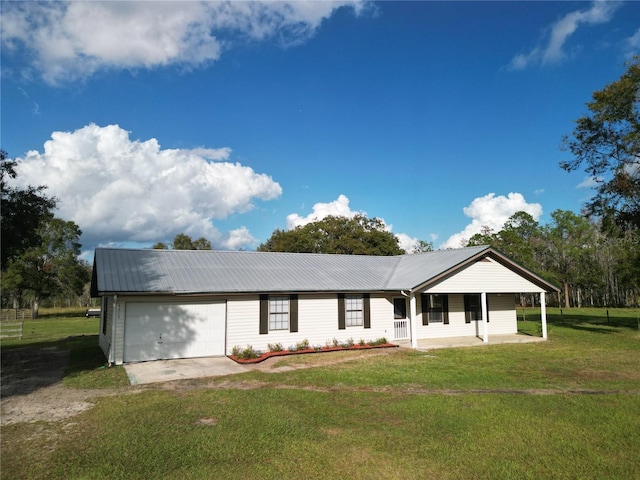 view of front of home with a porch, a front yard, and a garage