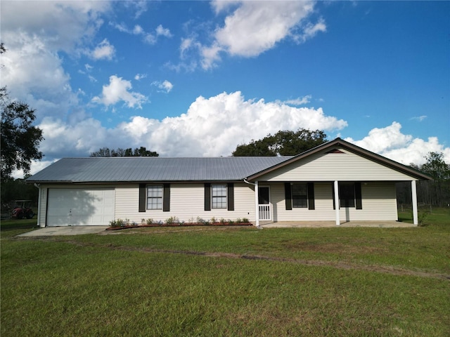 ranch-style house featuring a porch, a garage, and a front lawn