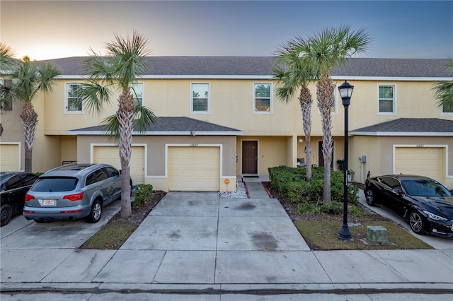 townhome / multi-family property featuring a garage