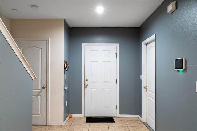 entrance foyer featuring light tile patterned floors