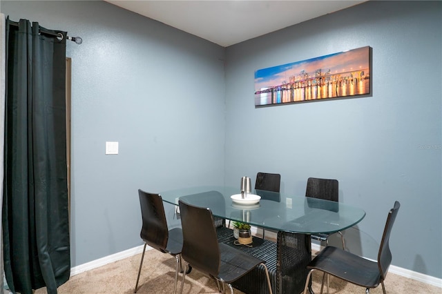 view of carpeted dining area