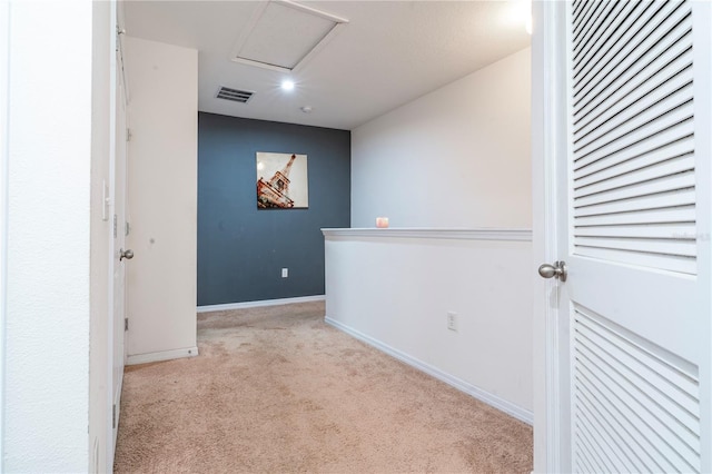 corridor with light colored carpet