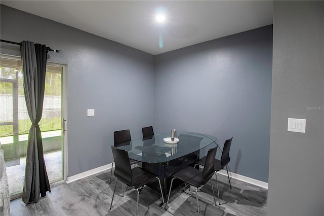 12827 Buffalo Run Dr, Gibsonton, FL 33534 - dining room with baseboards and wood finished floors